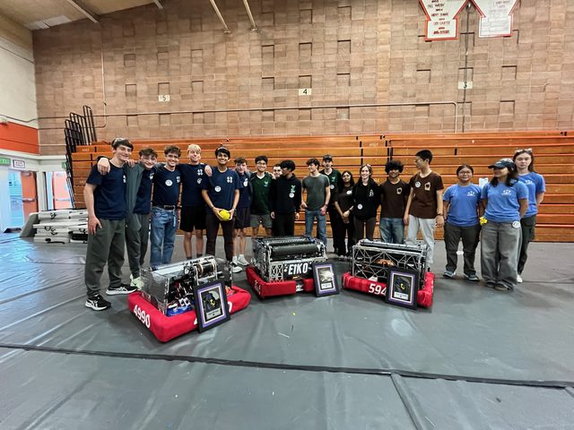 The three winning robots with their plaques